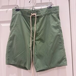 This is a pair of RRL green lace-up swim shorts made of 100% nylon. (